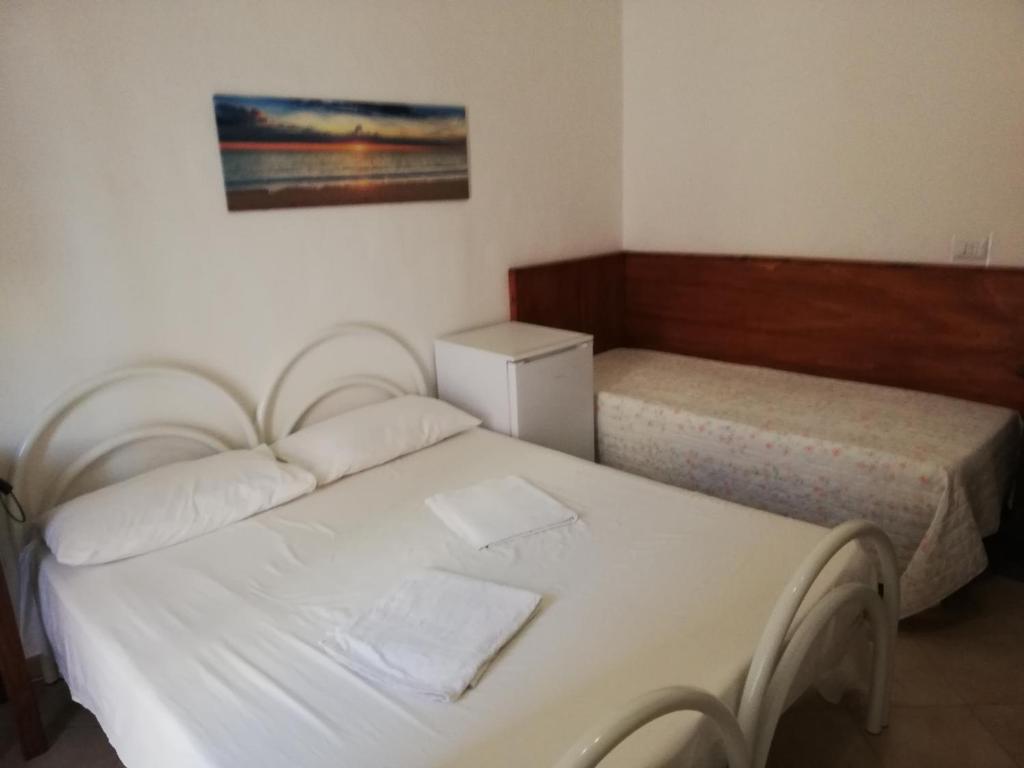 A bed or beds in a room at La Stanza Alternativa