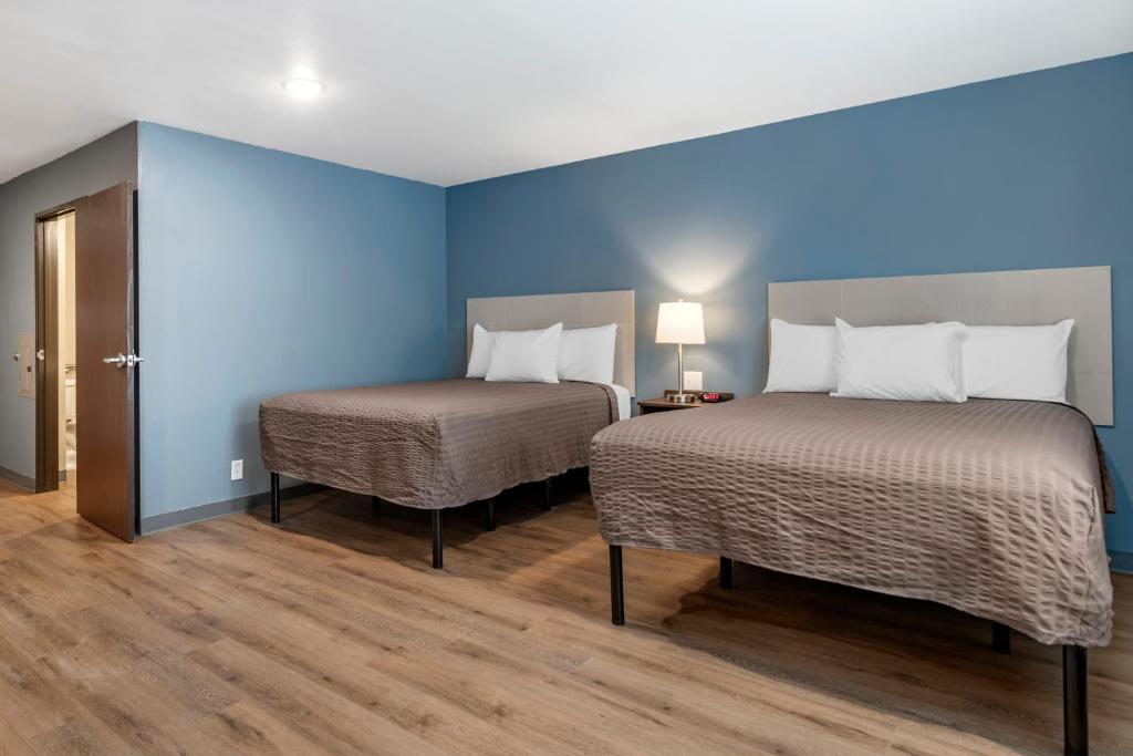 Postel nebo postele na pokoji v ubytování WoodSpring Suites Austin Georgetown
