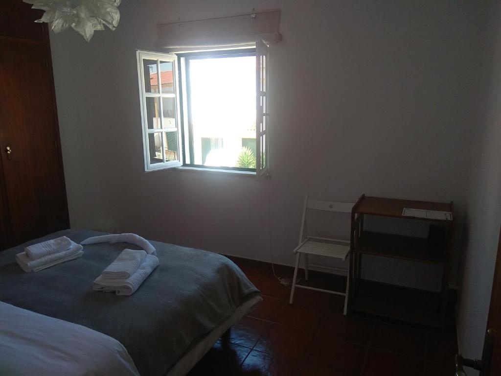 Postel nebo postele na pokoji v ubytování Ergobeach House