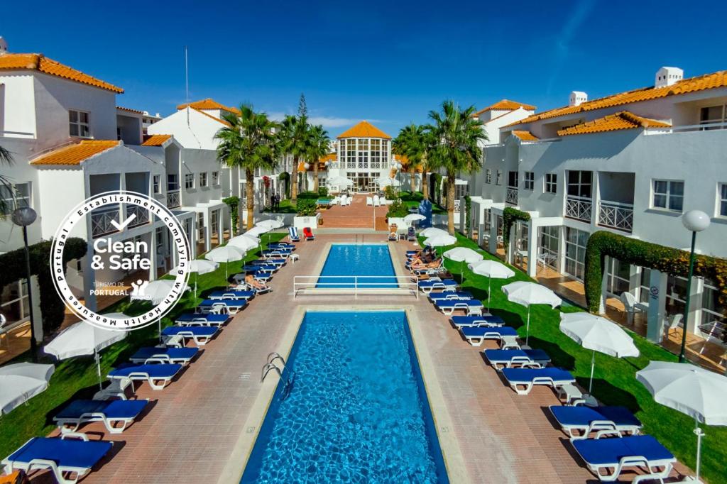 an aerial view of the pool at the casonlegate resort at Club Ouratlantico in Albufeira