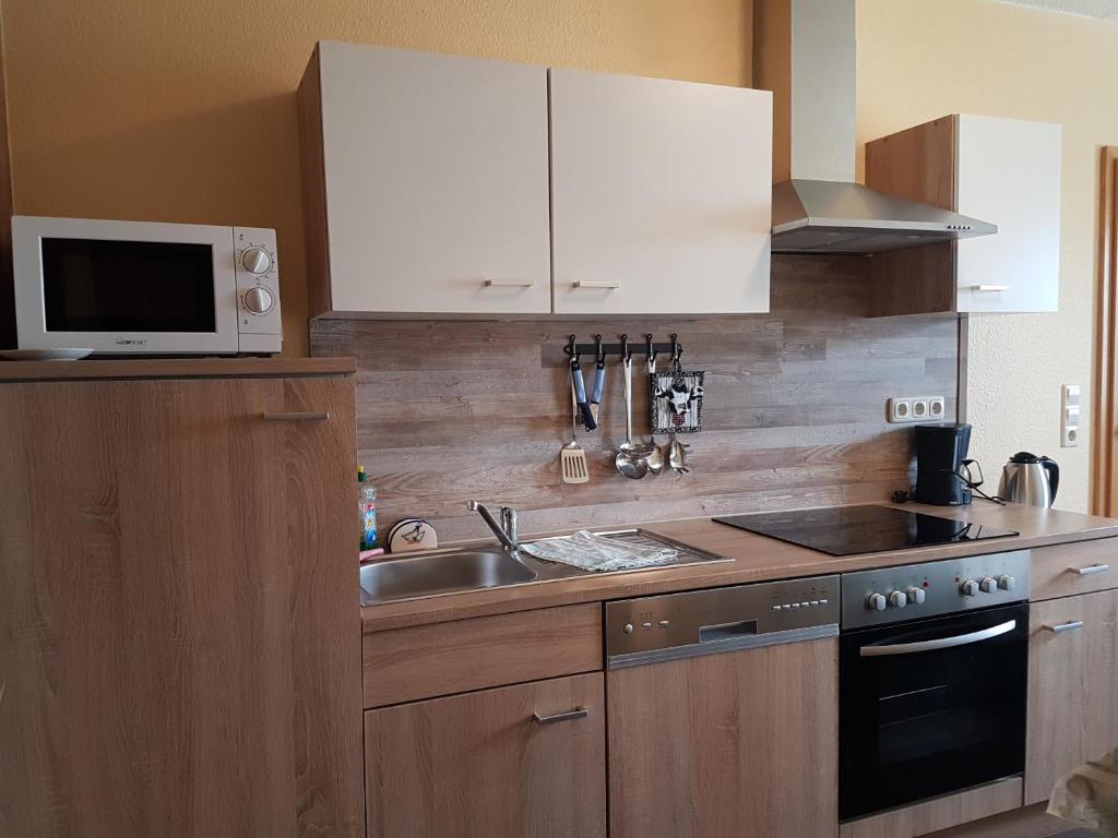 Kuchyň nebo kuchyňský kout v ubytování Gästehaus Hutweide