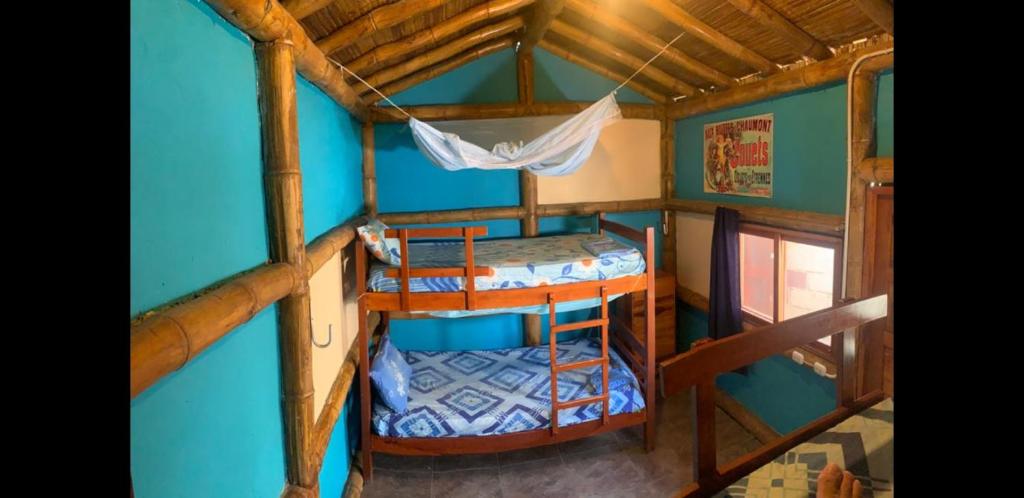 an overhead view of a room with two bunk beds at My Little House Surf&backpacker Hostel in Montañita