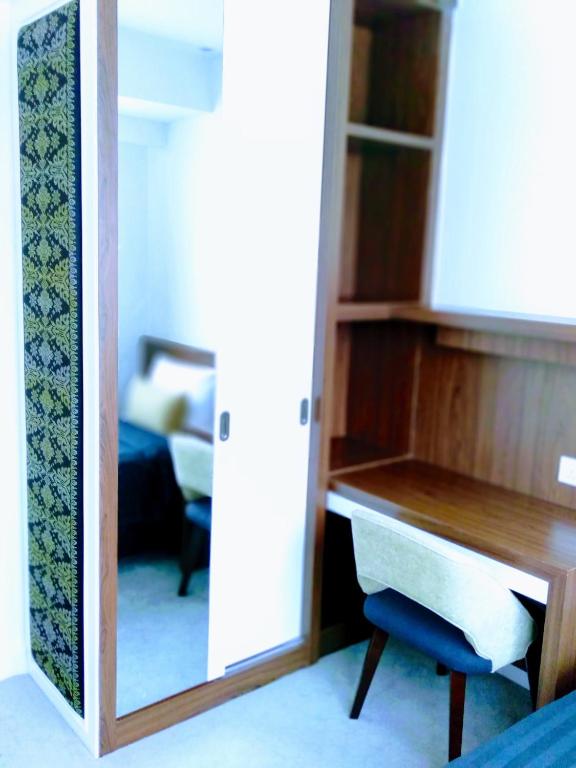 Postel nebo postele na pokoji v ubytování UTM Hotel & Residence