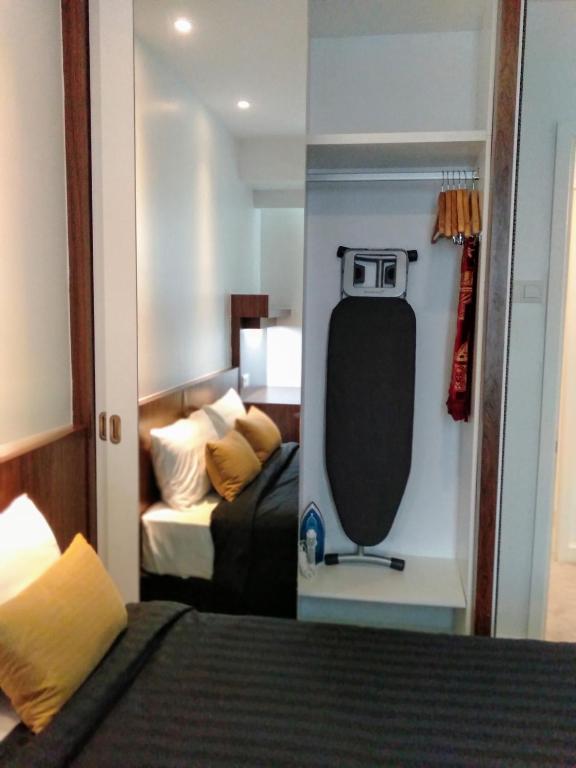 Postel nebo postele na pokoji v ubytování UTM Hotel & Residence