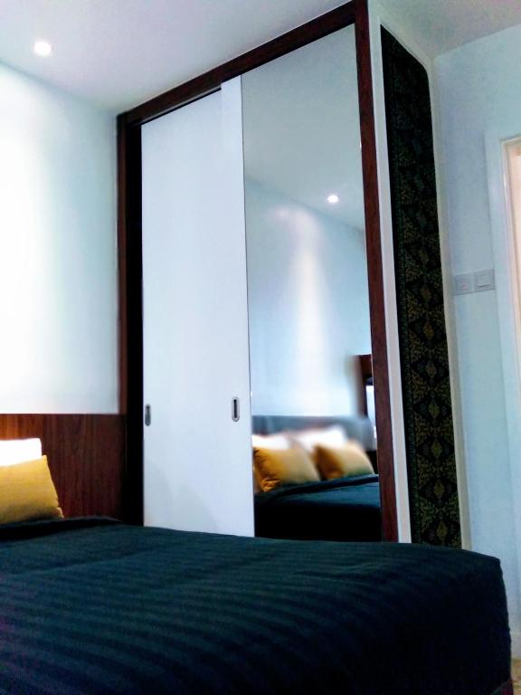 Postel nebo postele na pokoji v ubytování UTM Hotel & Residence
