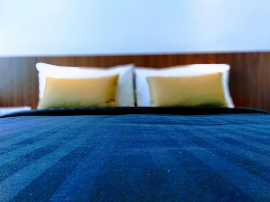 Postel nebo postele na pokoji v ubytování UTM Hotel & Residence