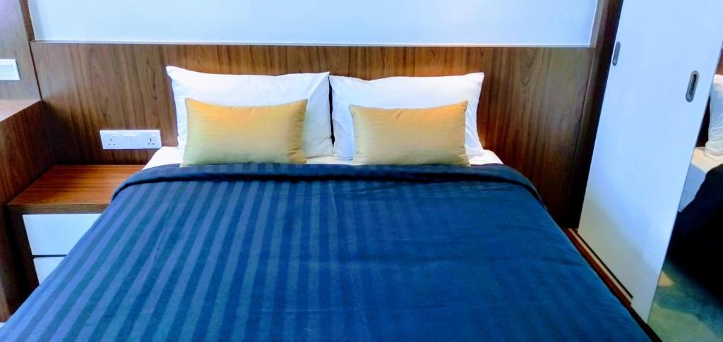 Postel nebo postele na pokoji v ubytování UTM Hotel & Residence