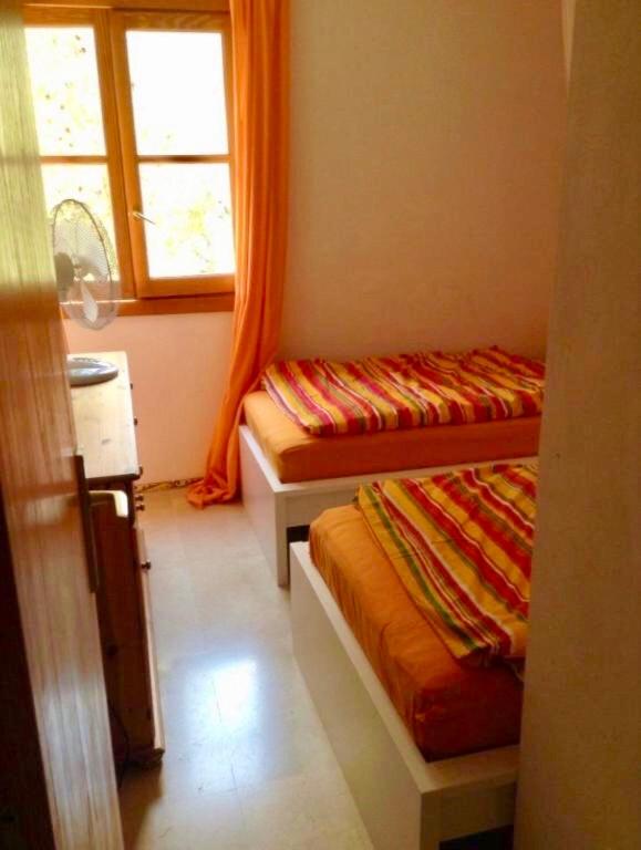 Postel nebo postele na pokoji v ubytování Hartmut Friedrich Apartment Port de Soller