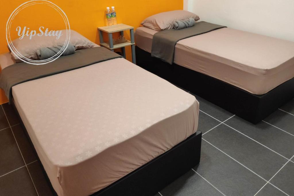 Postel nebo postele na pokoji v ubytování YipStay