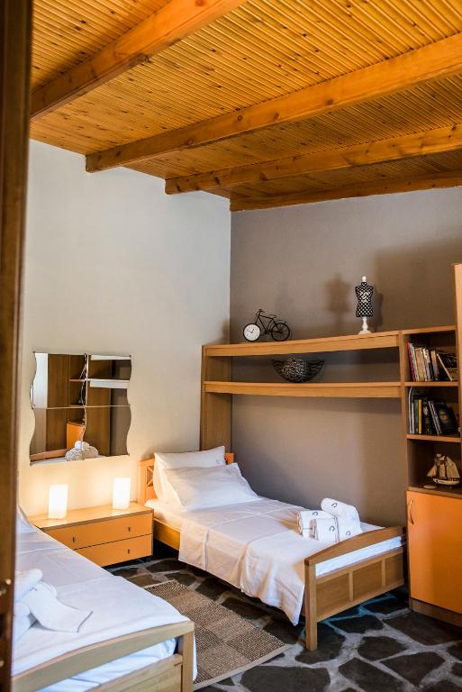 Postel nebo postele na pokoji v ubytování Eirinis House