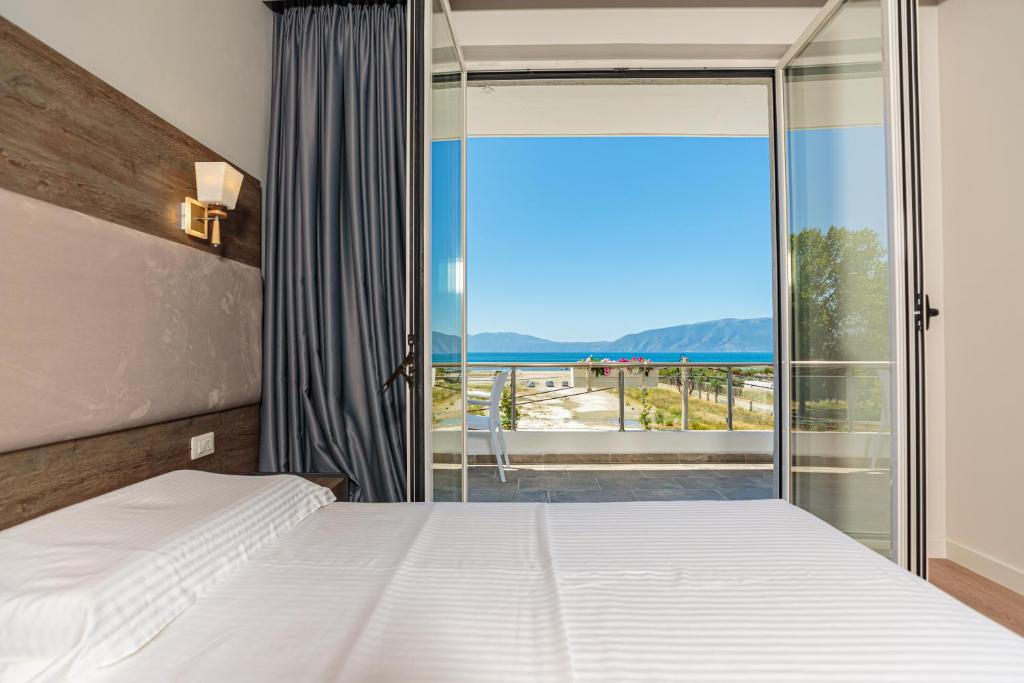 Postel nebo postele na pokoji v ubytování Real Hotel