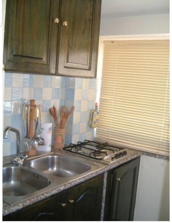 A kitchen or kitchenette at L' Attico