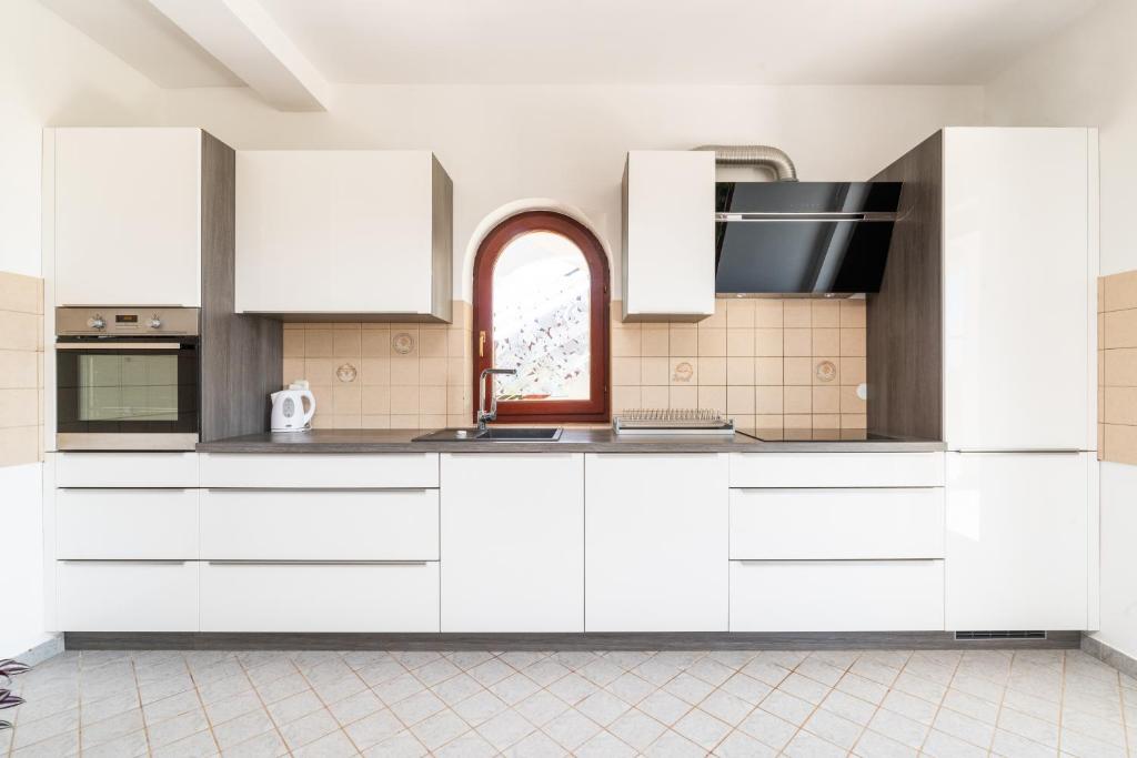 Kuchyňa alebo kuchynka v ubytovaní Apartman Petelin