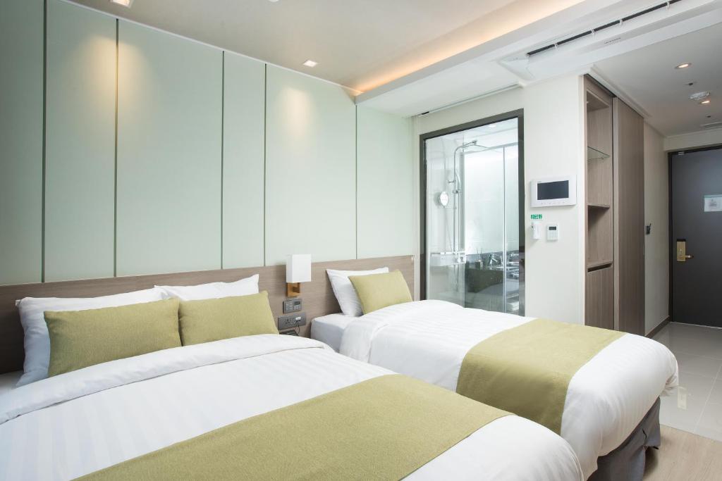 Postel nebo postele na pokoji v ubytování Utop Boutique Hotel&Residence