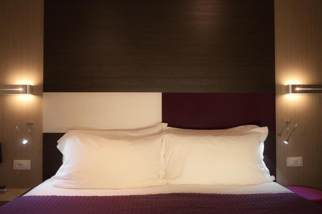 Postel nebo postele na pokoji v ubytování Genius Hotel Downtown