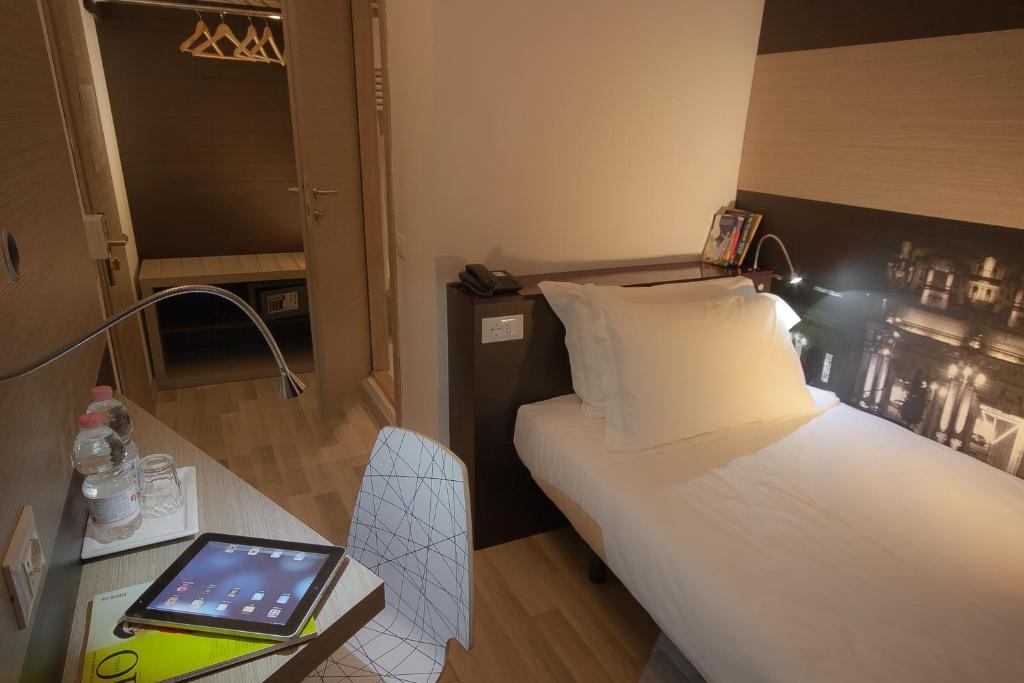 Postel nebo postele na pokoji v ubytování Genius Hotel Downtown