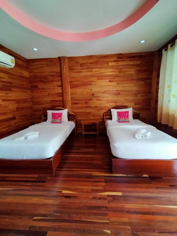 Postel nebo postele na pokoji v ubytování Palmsuay Resort