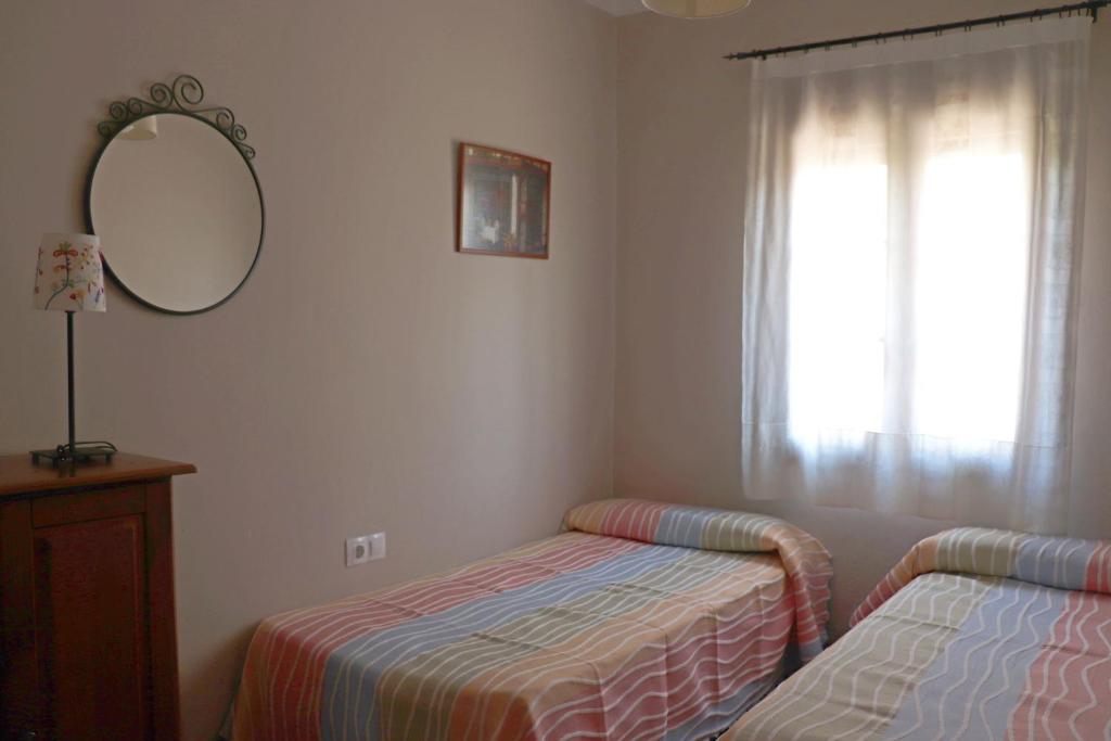 Postel nebo postele na pokoji v ubytování Casa la Barbacana