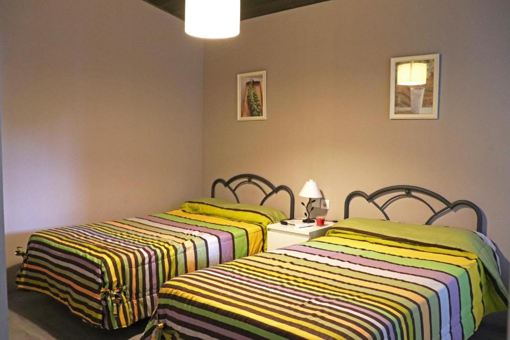 Postel nebo postele na pokoji v ubytování Casa la Barbacana