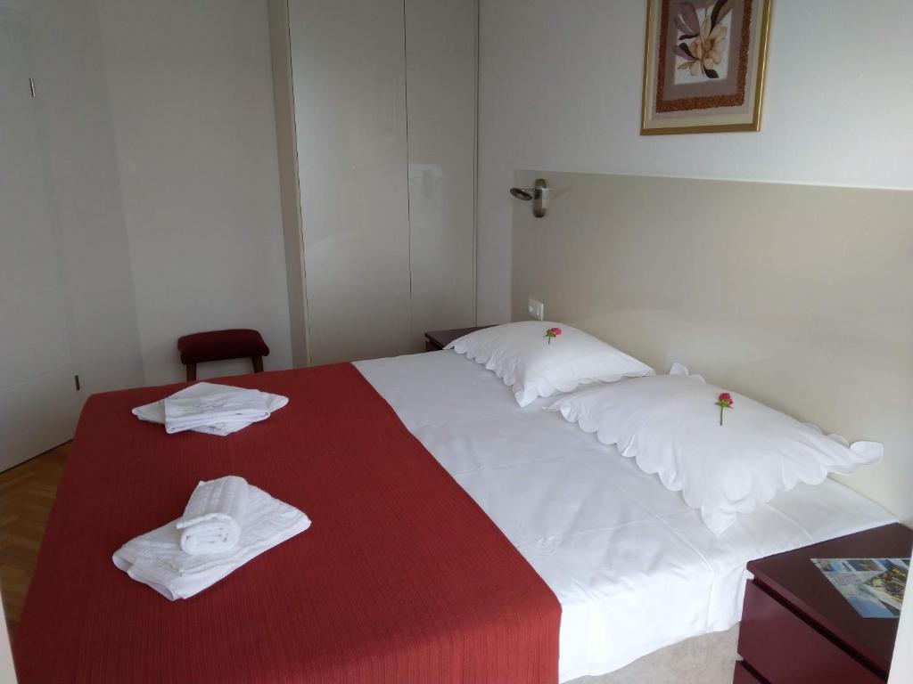 Postel nebo postele na pokoji v ubytování Apartmani Ines