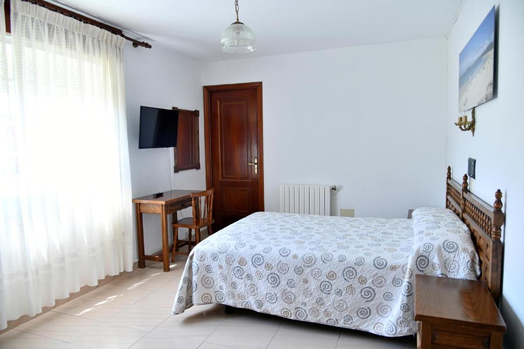 Posteľ alebo postele v izbe v ubytovaní Hotel Maruxa
