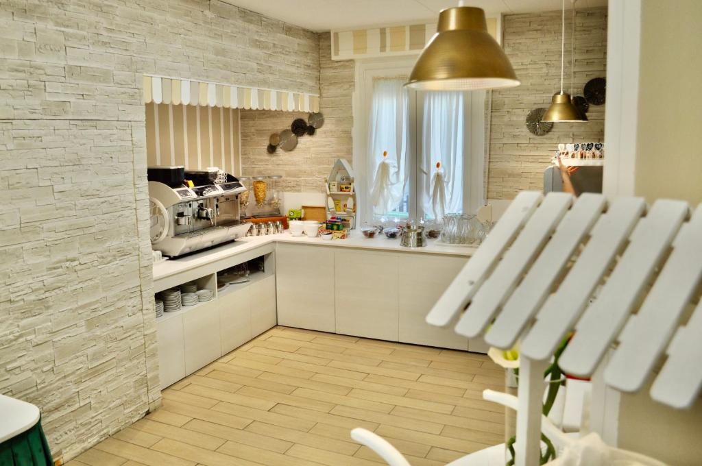 Kuchyň nebo kuchyňský kout v ubytování Hotel Corallo Garnì