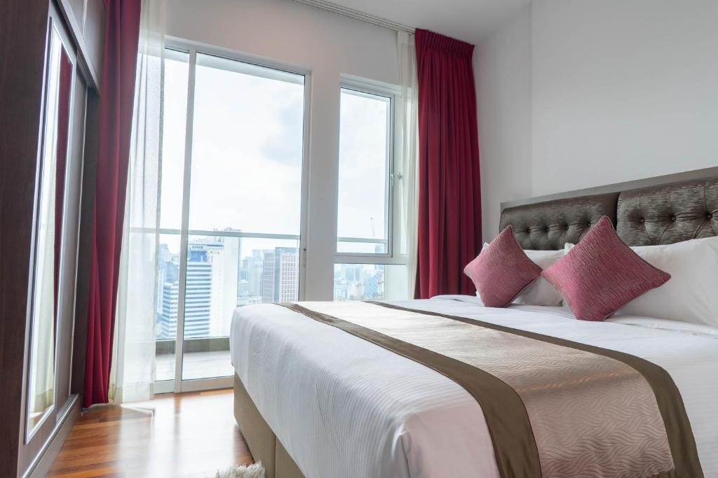 Katil atau katil-katil dalam bilik di Tamu Hotel & Suites Kuala Lumpur