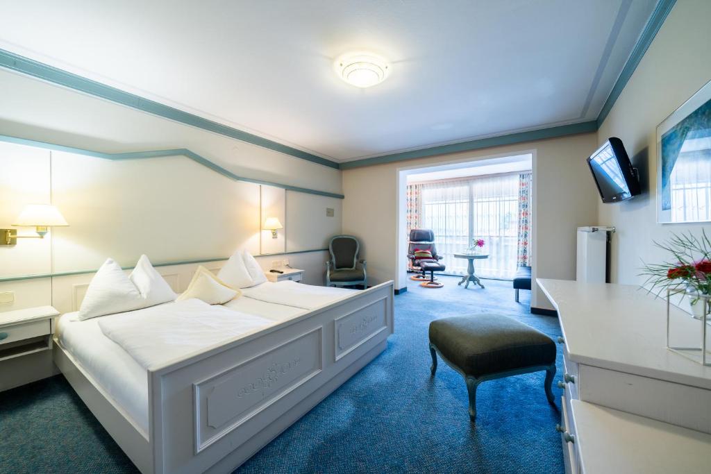Postel nebo postele na pokoji v ubytování Hotel Alexanderhof