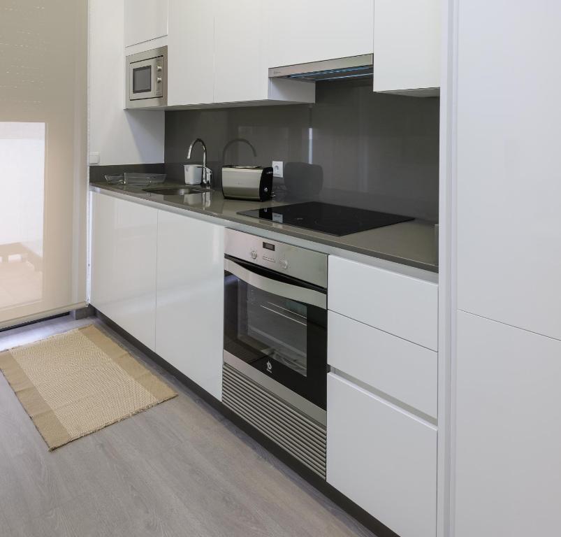 Kuchyňa alebo kuchynka v ubytovaní Apartamentos Lanceata
