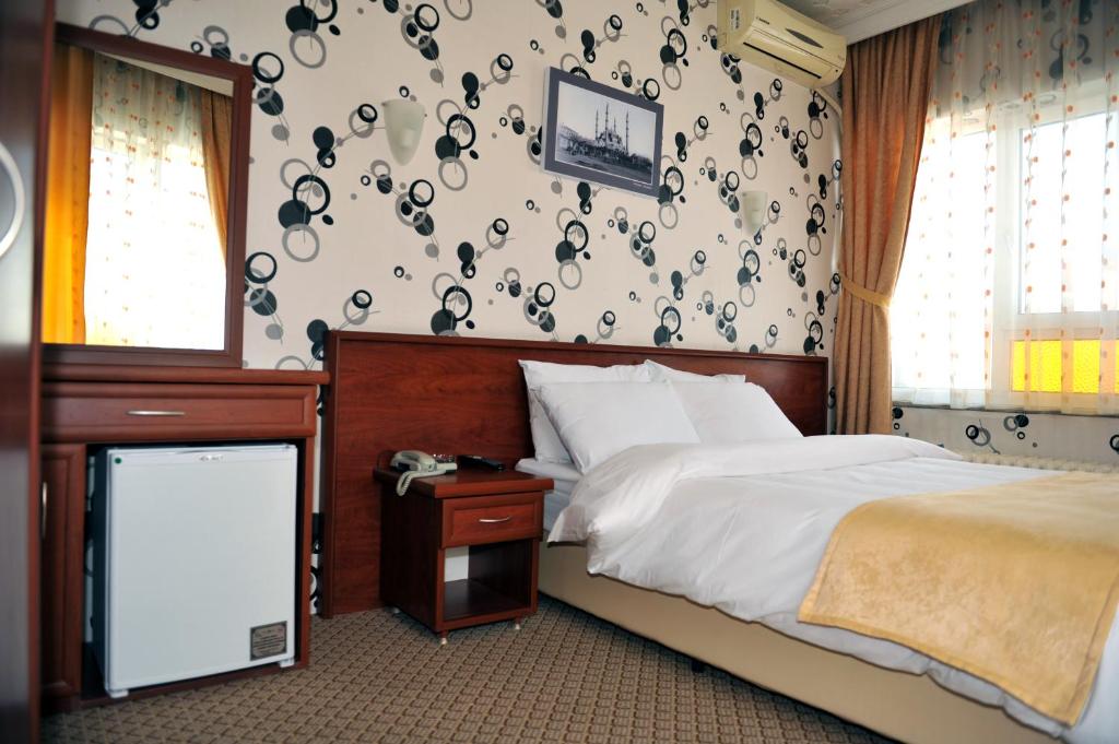 Postel nebo postele na pokoji v ubytování Saray Hotel