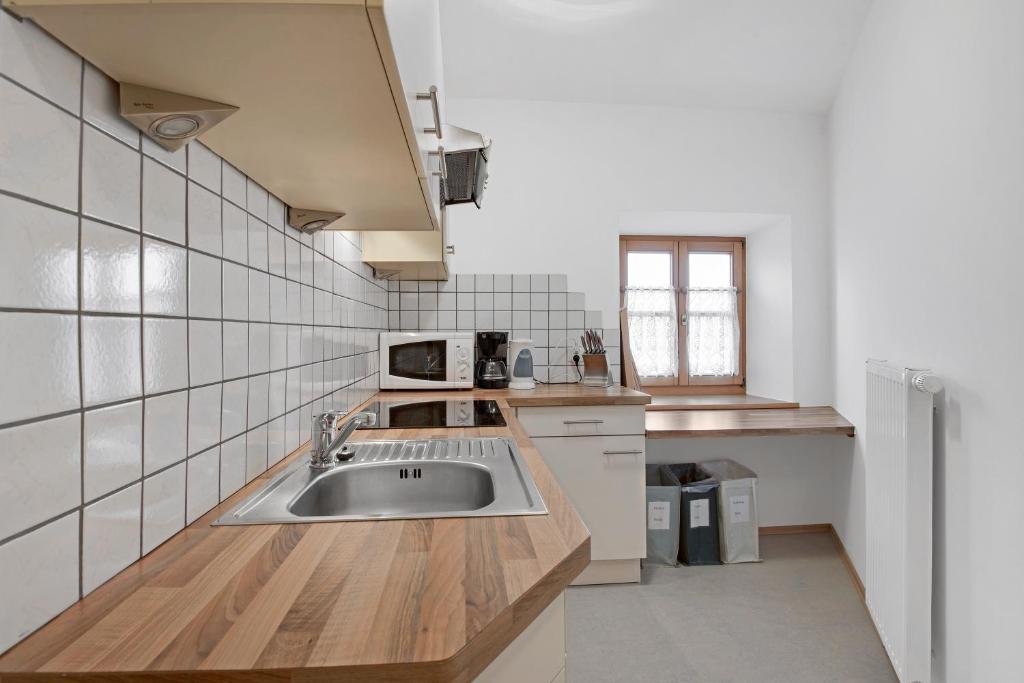 Kuchyň nebo kuchyňský kout v ubytování Rafaser - Apartment Rustika