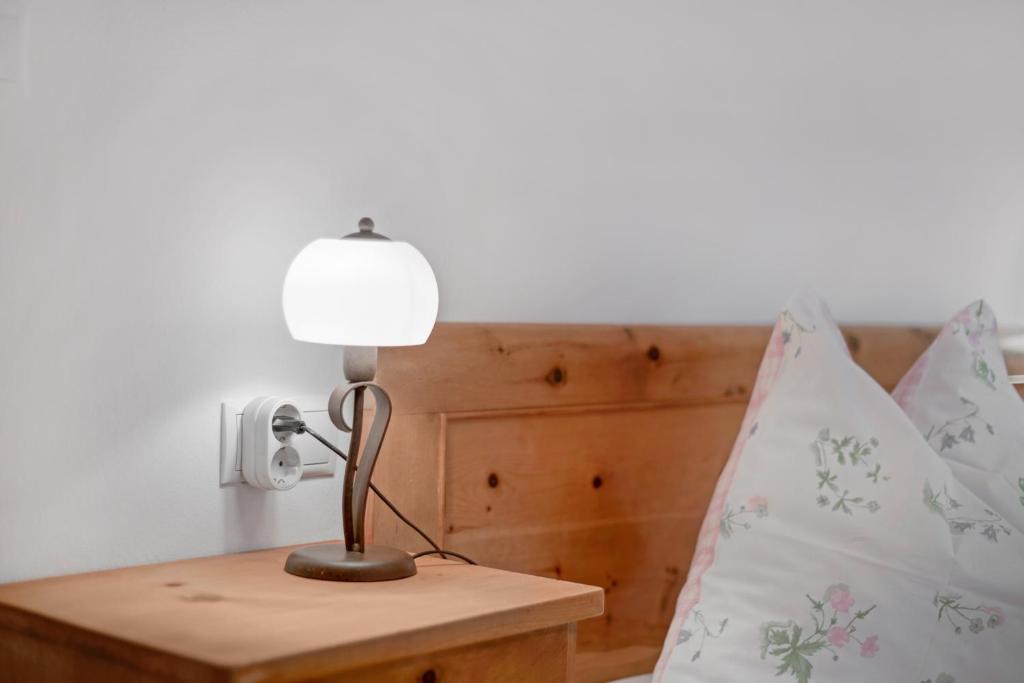 Postel nebo postele na pokoji v ubytování Rafaser - Apartment Rustika