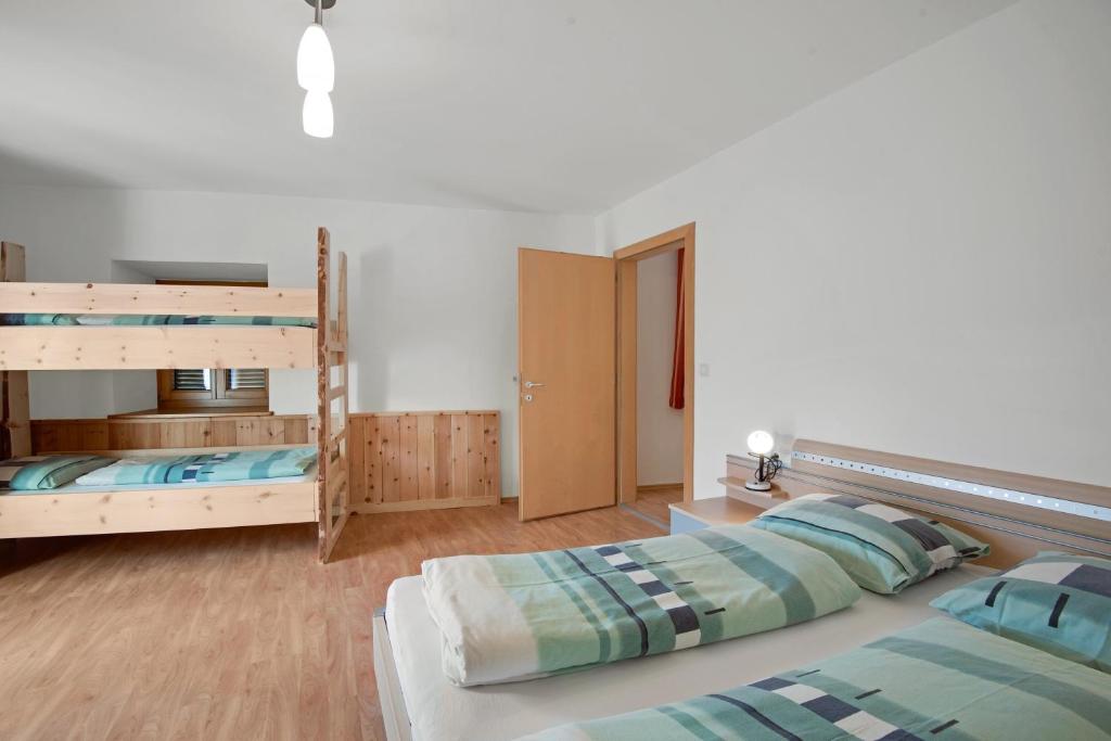 Postel nebo postele na pokoji v ubytování Rafaser - Apartment Albina
