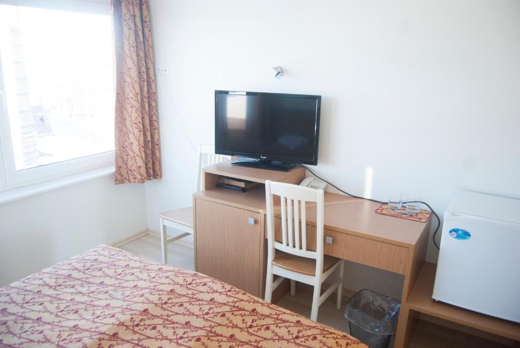 TV a/nebo společenská místnost v ubytování Carolina Hotel