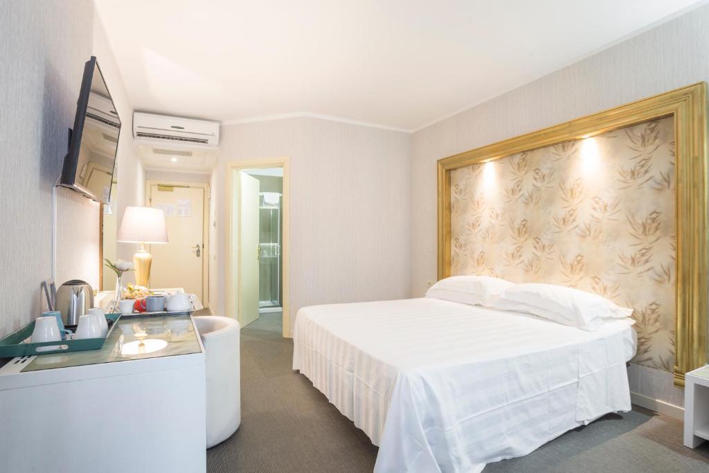 Postel nebo postele na pokoji v ubytování Hotel Repubblica Marinara
