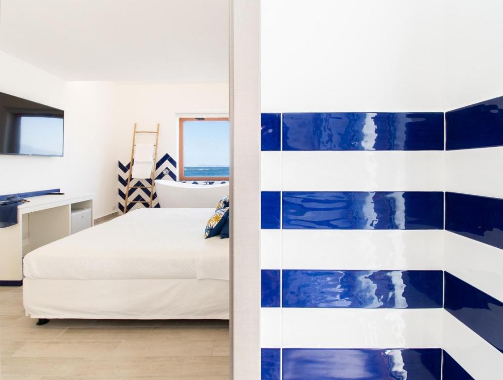 Postel nebo postele na pokoji v ubytování Sapphire Rooms