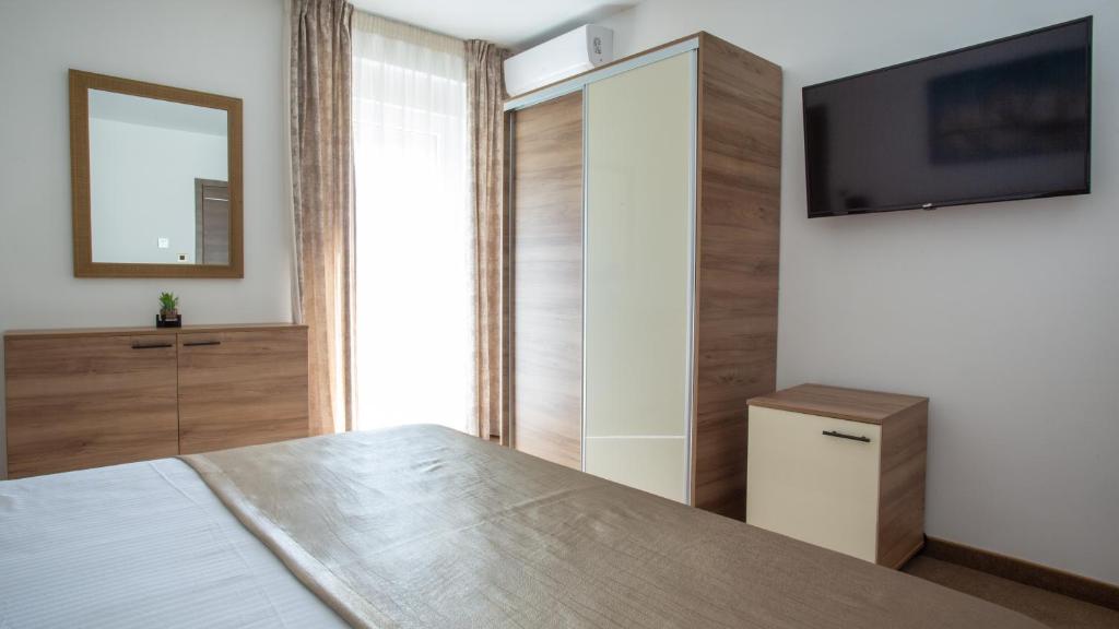 TV a/nebo společenská místnost v ubytování Rooms & Apartments Toni