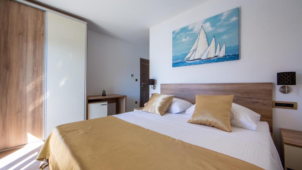 Postel nebo postele na pokoji v ubytování Rooms & Apartments Toni