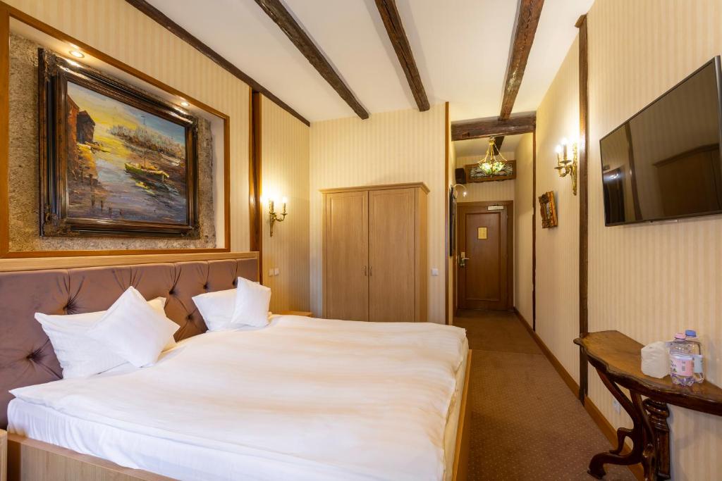 Postel nebo postele na pokoji v ubytování Hotel Am Ring