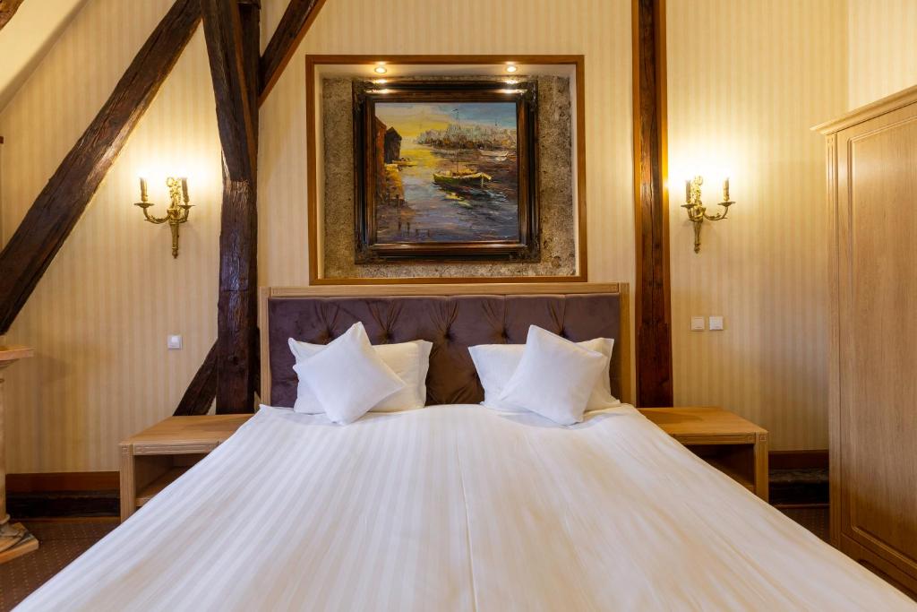 Postel nebo postele na pokoji v ubytování Hotel Am Ring