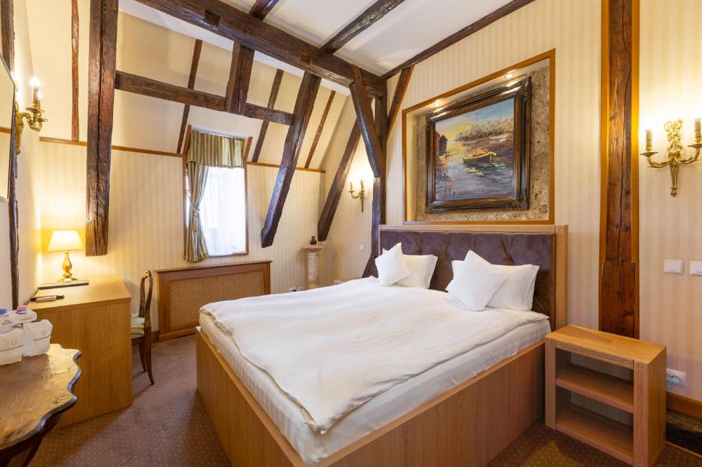 Postel nebo postele na pokoji v ubytování Hotel Am Ring