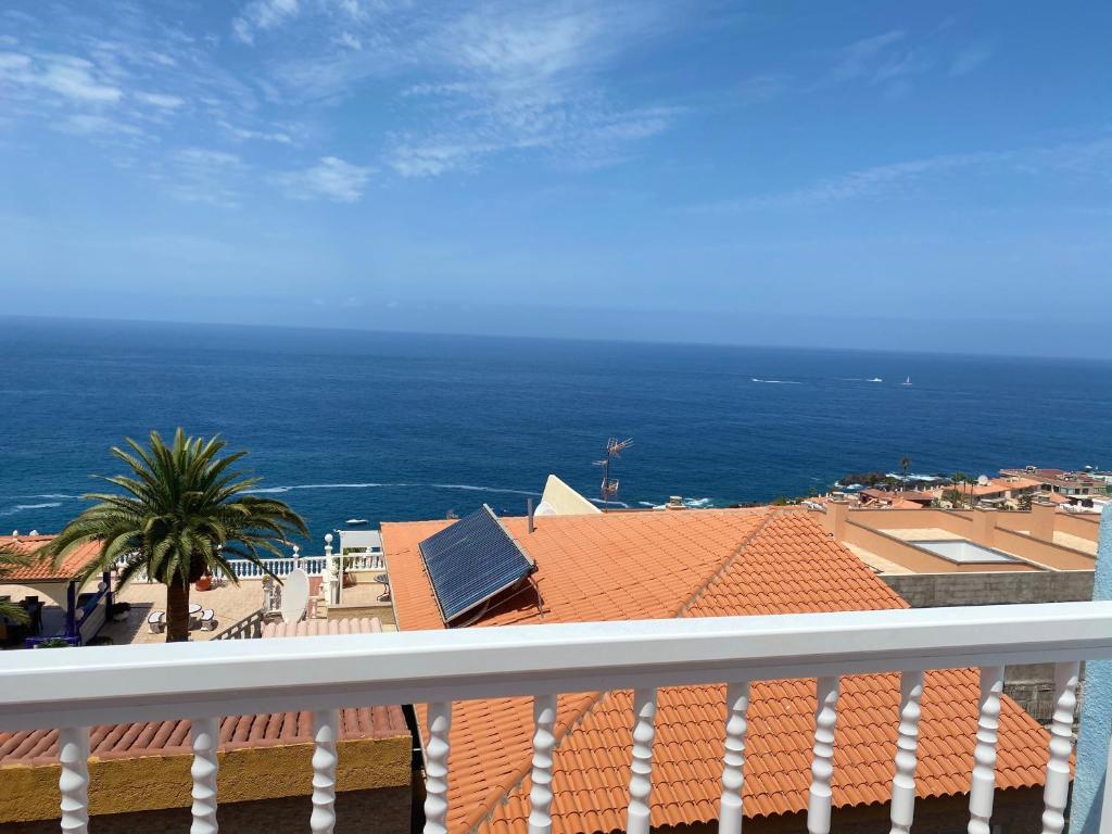 a view of the ocean from a balcony at Ático Los Ángeles Min 3 nights in Puerto de Santiago