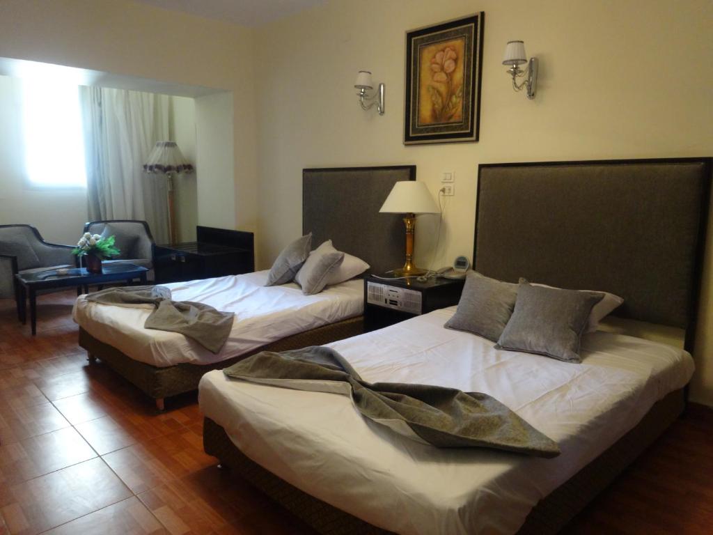 Postel nebo postele na pokoji v ubytování Indiana Hotel