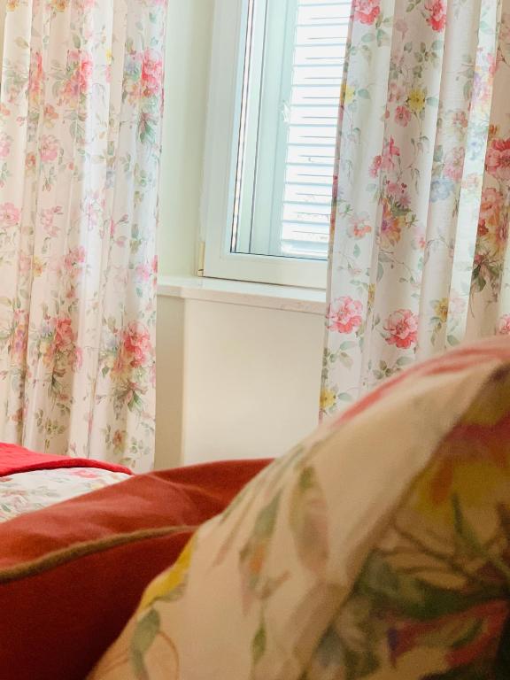 Łóżko lub łóżka w pokoju w obiekcie La Casetta di Gloria