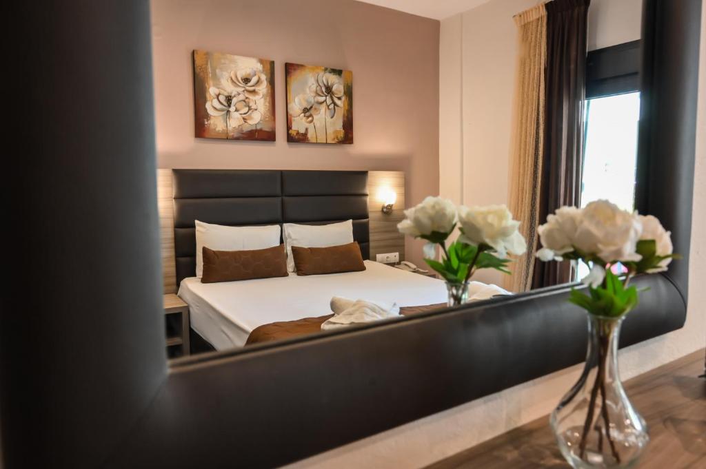Posteľ alebo postele v izbe v ubytovaní Hotel Kostas