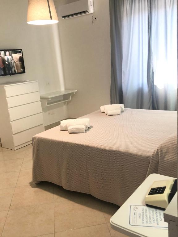 Postel nebo postele na pokoji v ubytování Hotel Residence Turium