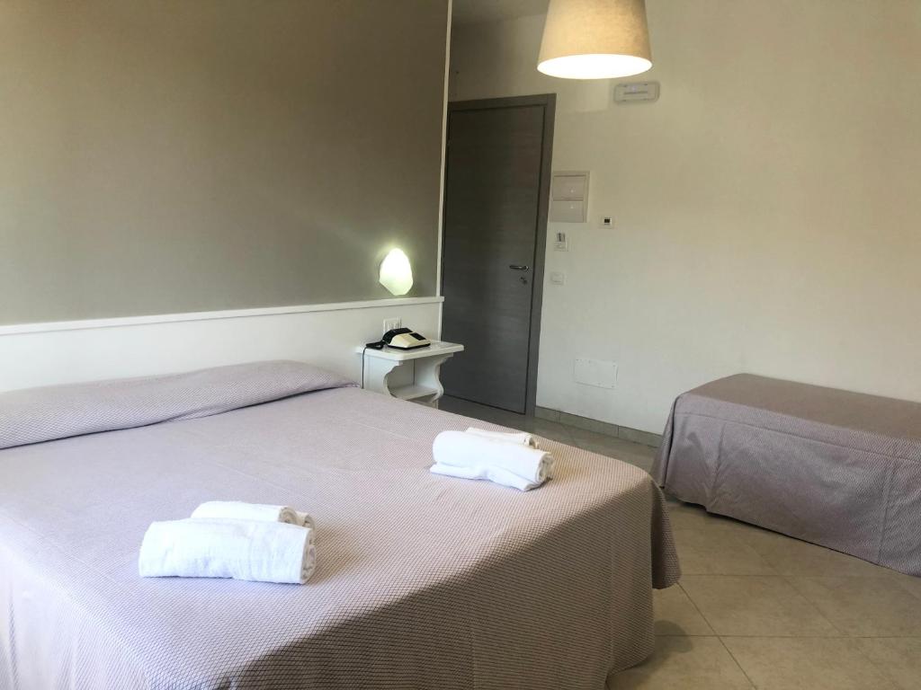 Postel nebo postele na pokoji v ubytování Hotel Residence Turium