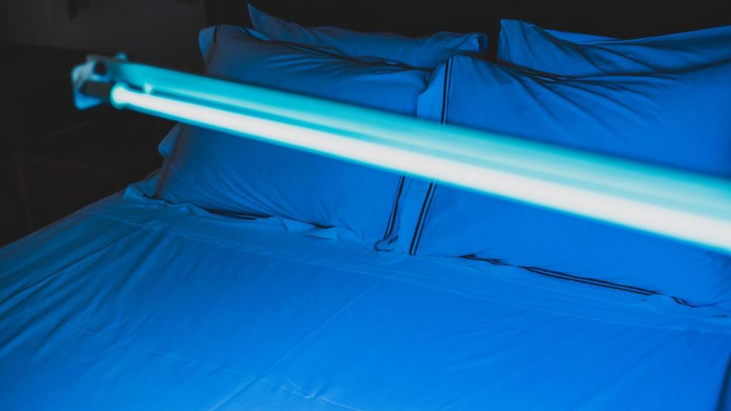 Posteľ alebo postele v izbe v ubytovaní Keros Art Hotel
