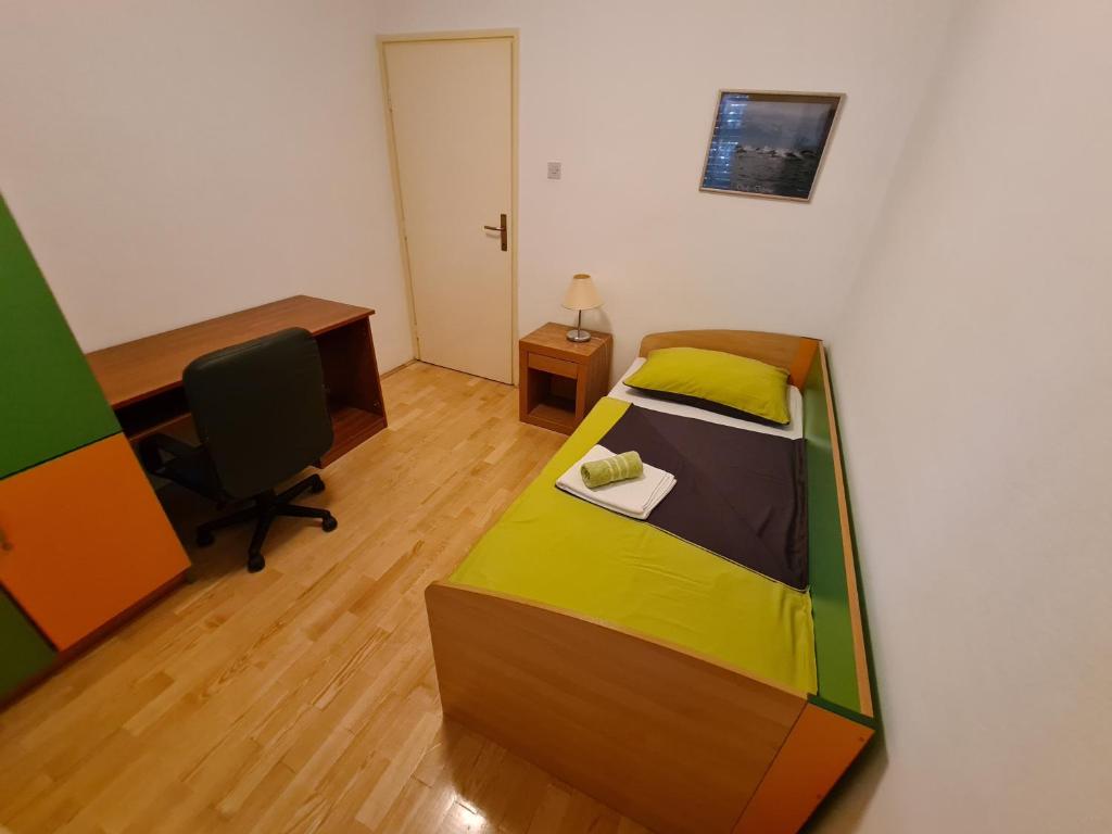 Postel nebo postele na pokoji v ubytování Apartments Ivana