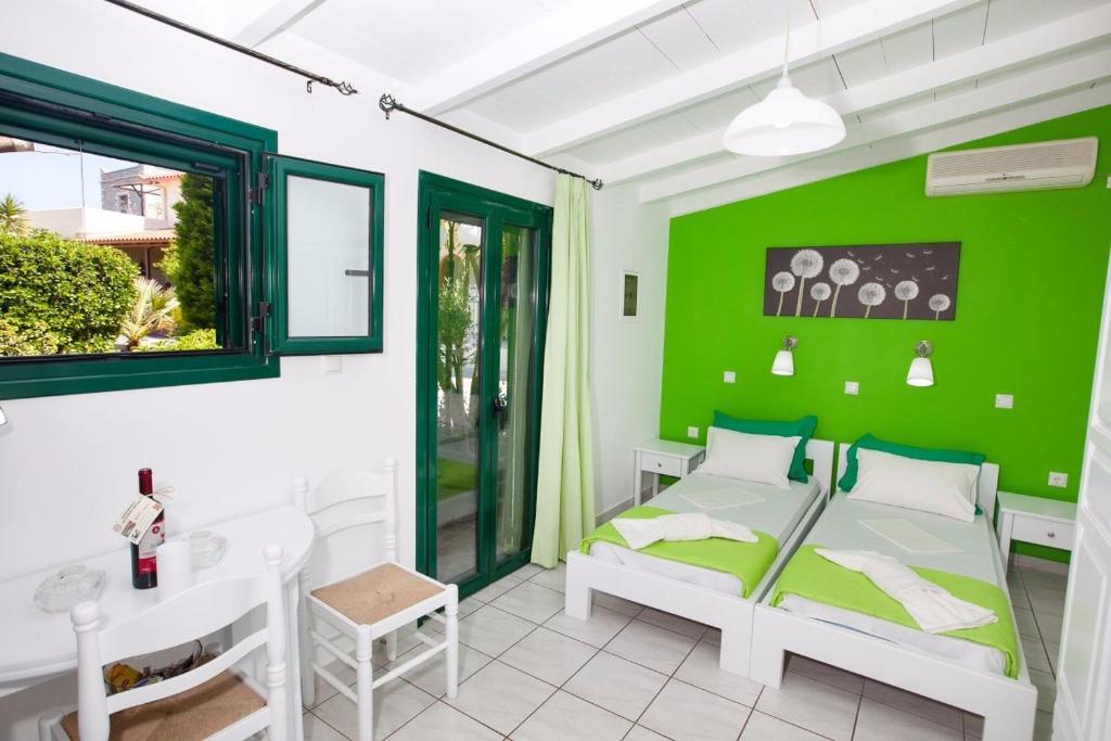 A bed or beds in a room at Athina Apartments
